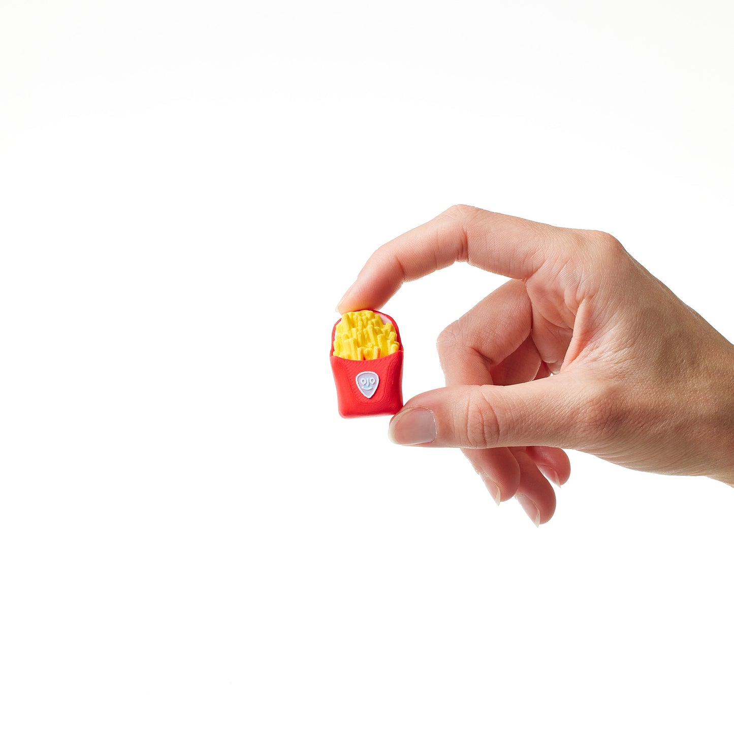 Fries Topper in hand showing scale and size of pedal footswitch accessory