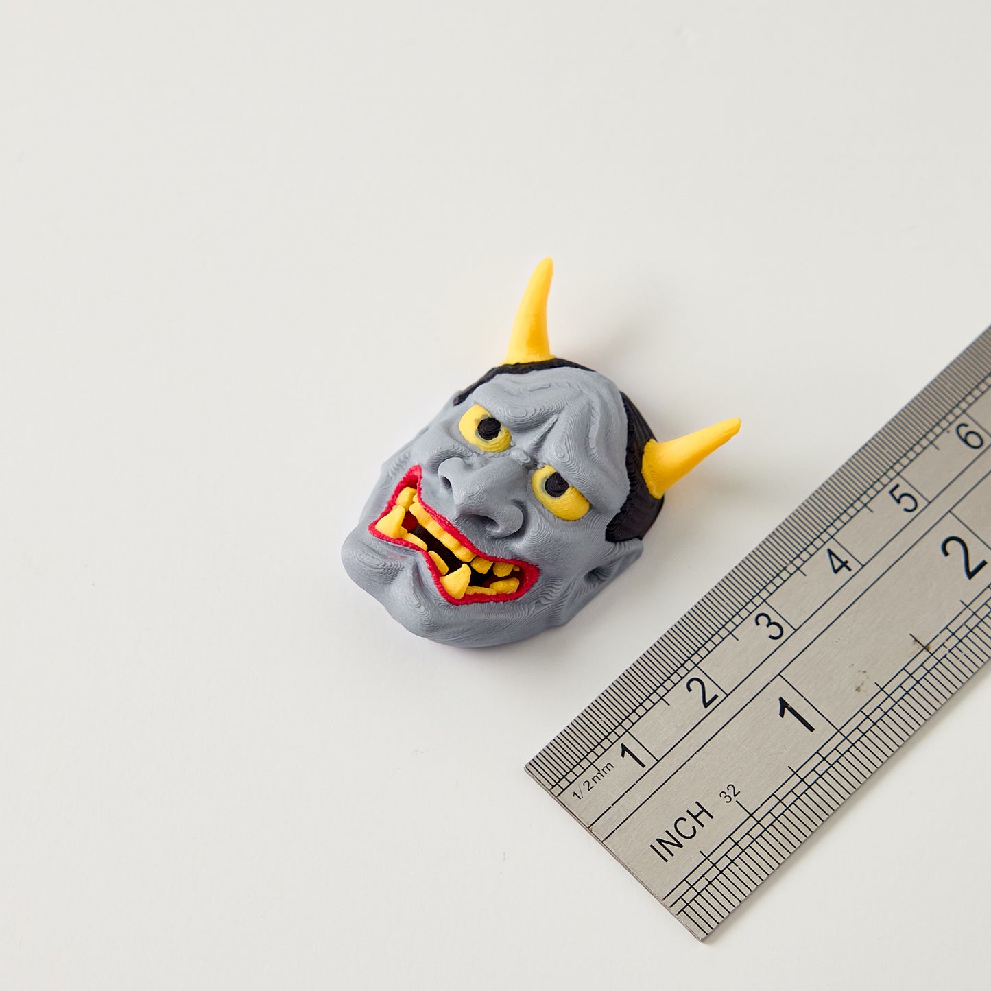 Hannya Topper — close up detail of demon mask eyes nose mouth and hand finished surface texture for guitar pedal customization
