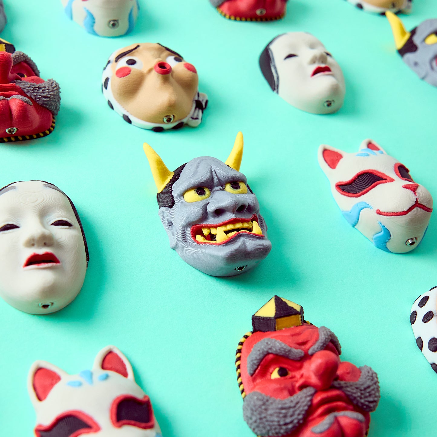 Hannya Topper in center of the entire Masks collection — secondary angled view emphasizing demon mask contours and horn symmetry for 10mm effects pedal footswitch
