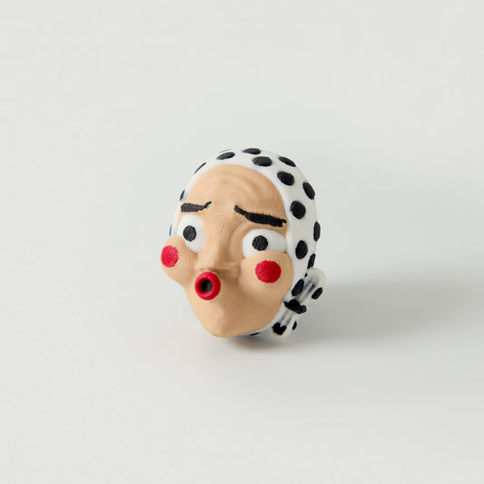 Hyottoko Topper — Japanese folk mask puckered lips design effects pedal switch topper front view for 10mm guitar and bass footswitch