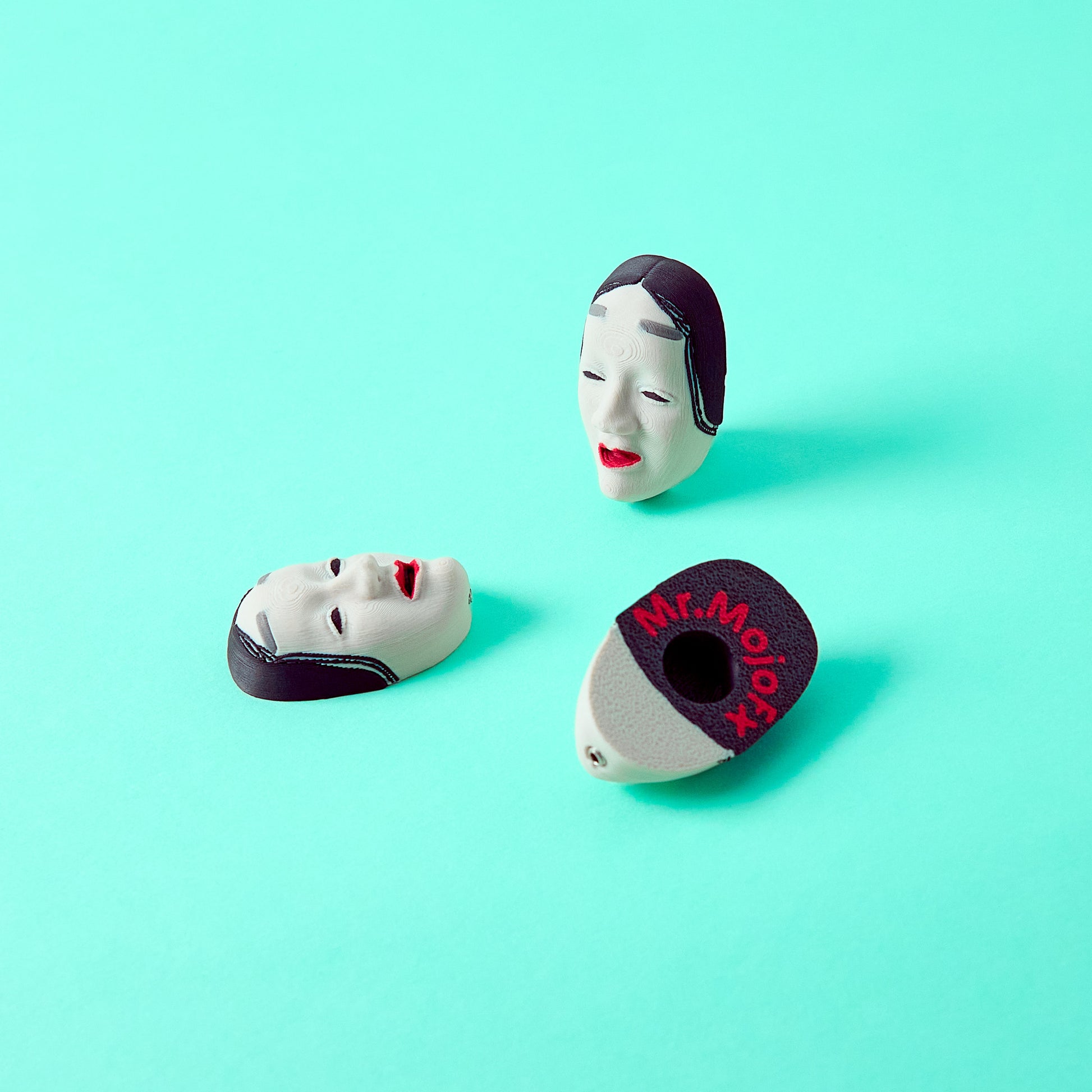 Koomote Topper — Japanese Noh pale mask pedal switch topper on teal background showing front, back and angled views