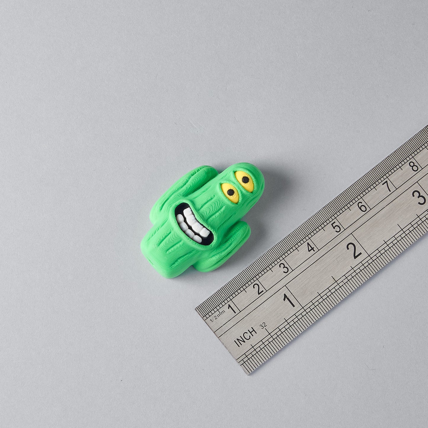 LURK cactus guitar pedal switch topper next to a ruler for size reference, Mr.MojoFx Artist Series
