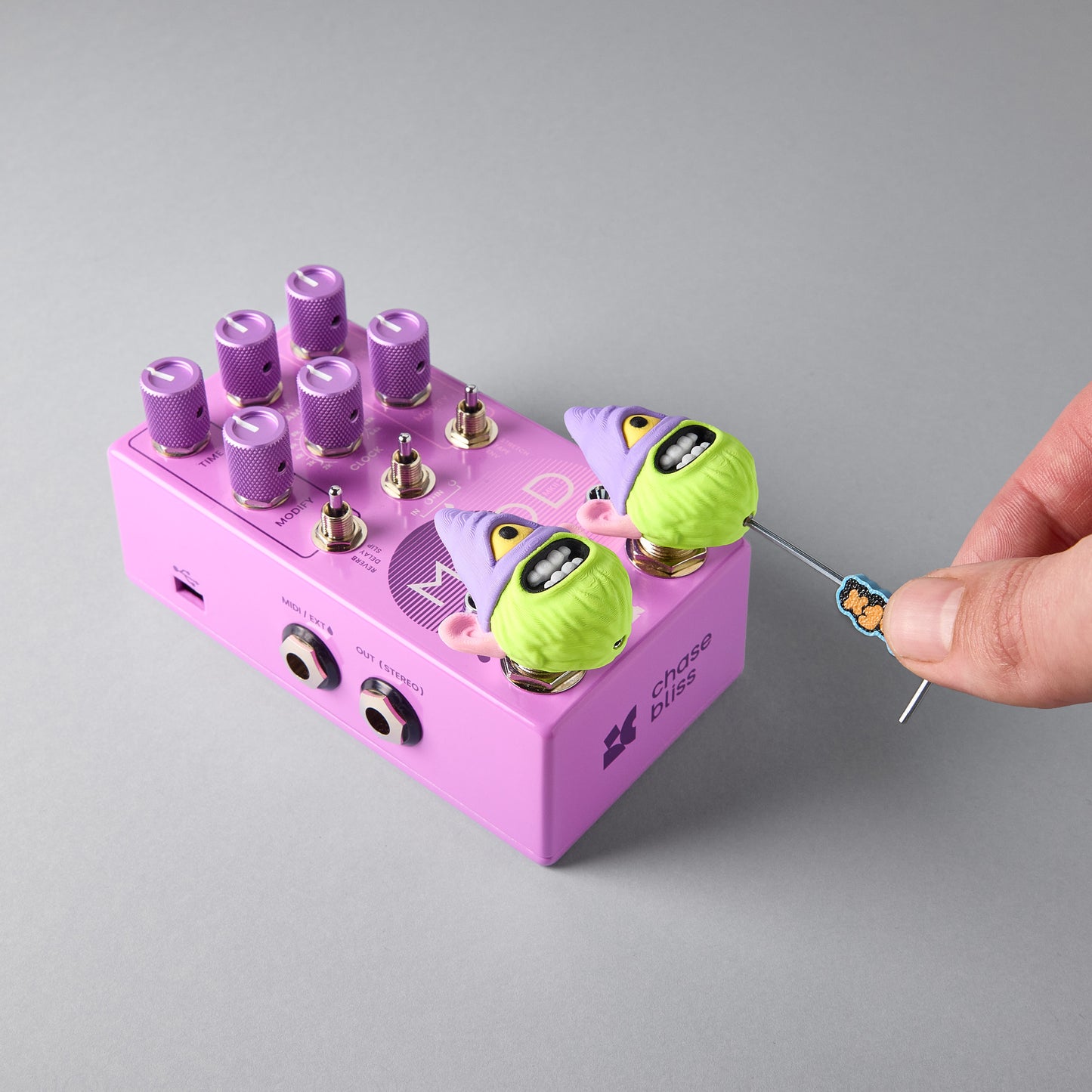 LURK gnome topper being installed on a Chase Bliss MOOD II guitar pedal footswitch with the Mr.MojoFx 1.5mm Allen key