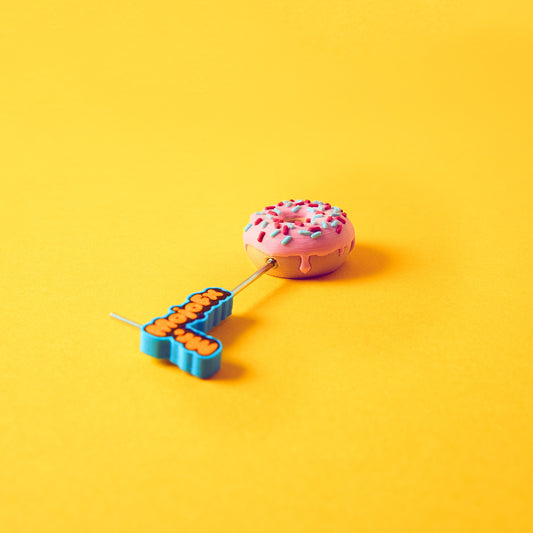 Mr.MojoFx 1.5mm Allen key screwing one Munchies Donut footswitch topper on yellow background