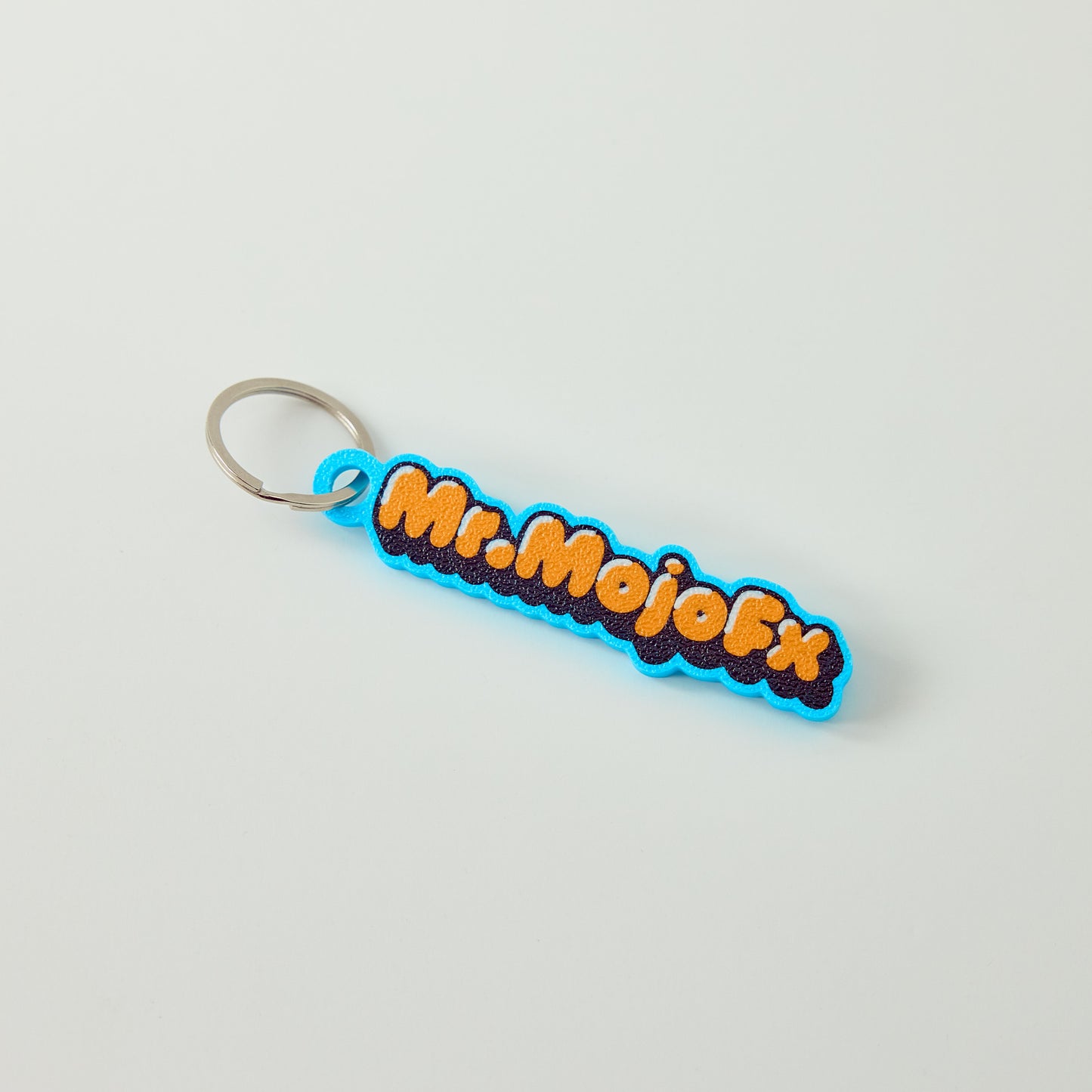 Mr.MojoFx Classic Key Fob — full colour logo keychain, front view