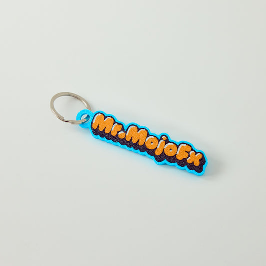 Mr.MojoFx Classic Key Fob — full colour logo keychain, front view