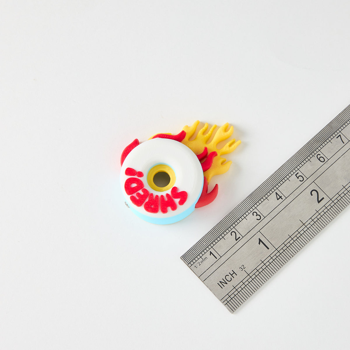 Mr.MojoFX Dogtown SHRED Skate Wheel switch topper next to a ruler for size reference – approximately 5cm long, Dogtown Collection