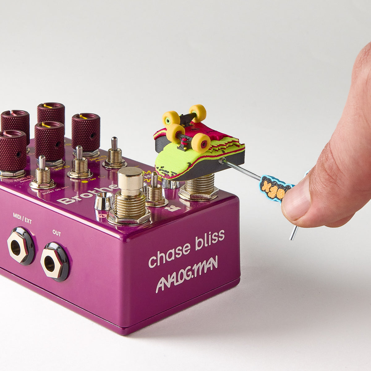 Installing a Mr.MojoFX Dogtown switch topper onto a purple Chase Bliss Brothers AM guitar pedal using the 1.5mm Allen key