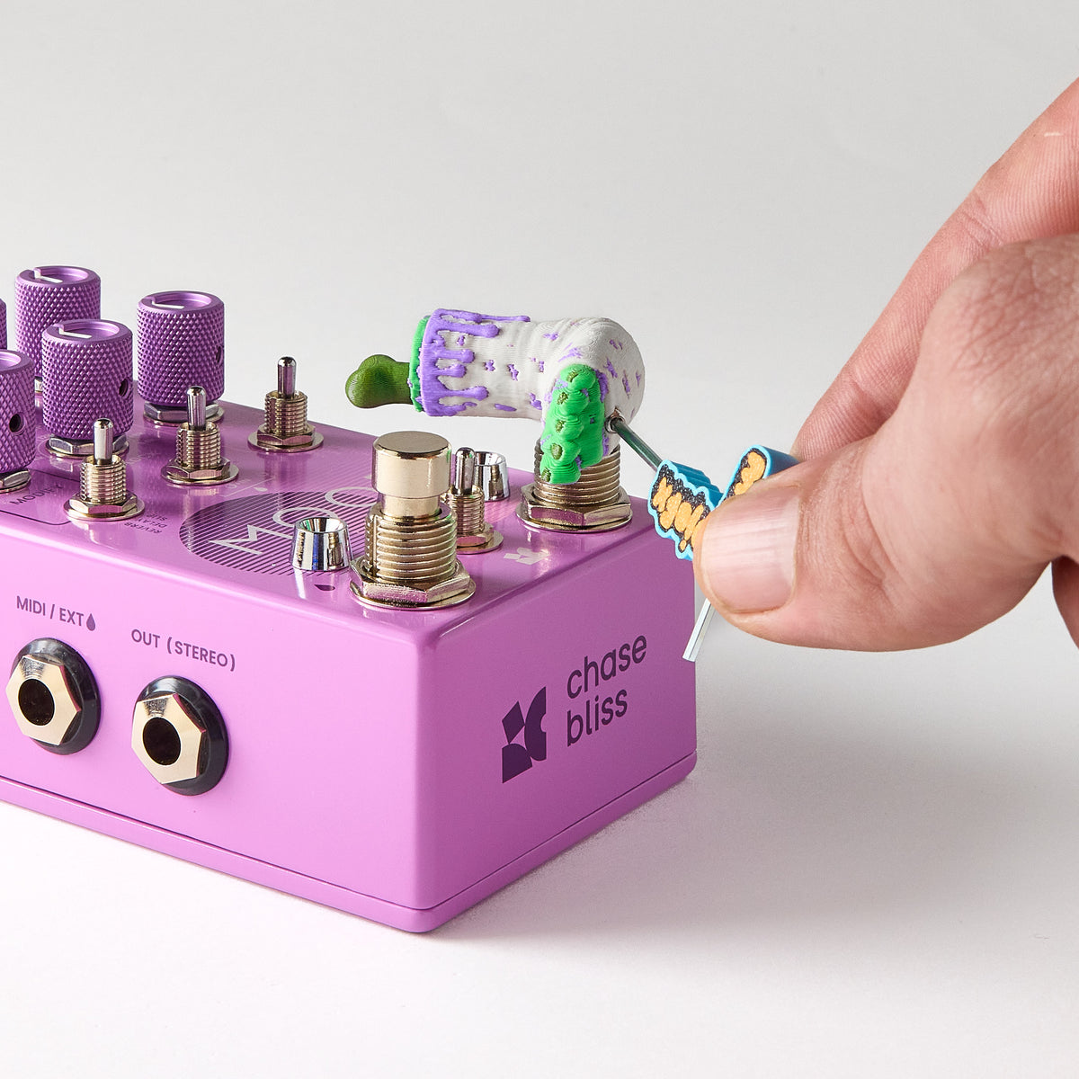Installing a Mr.MojoFX Dogtown Zombie Leg switch topper onto a purple Chase Bliss MOODII guitar pedal using the 1.5mm Allen key