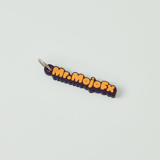 Mr.MojoFx mini key fob — branded logo keychain, front view