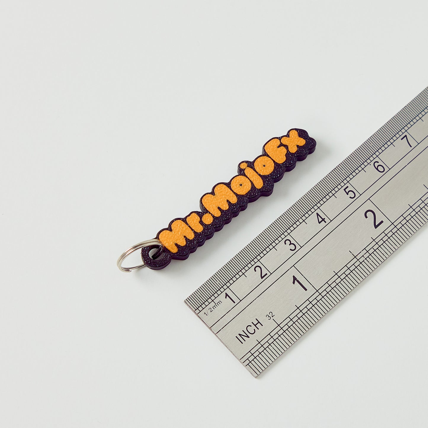 Mr.MojoFx mini key fob — size reference showing 60mm length