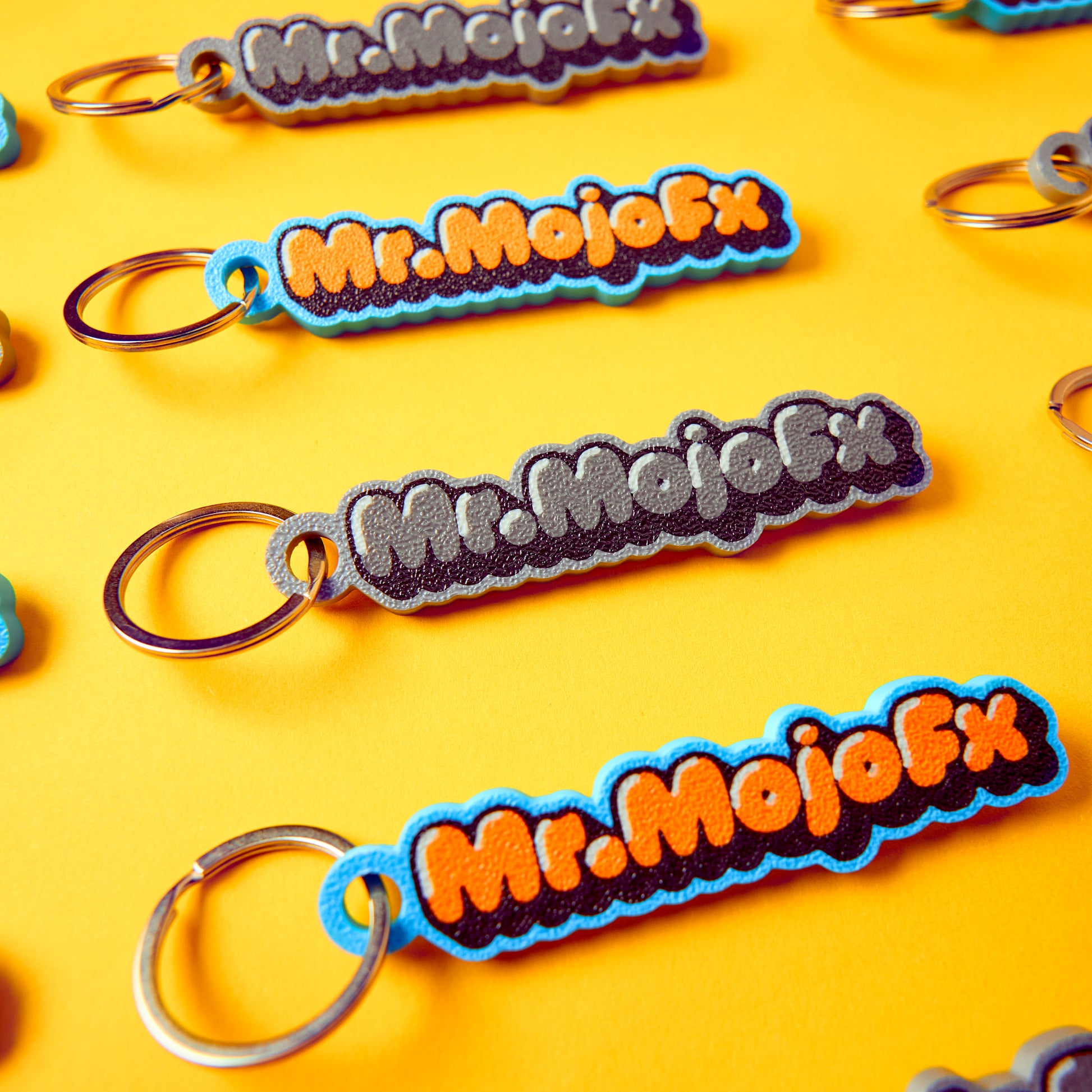 MrMojoFx Mono Key Fob on keys, lifestyle angle shot, yellow background