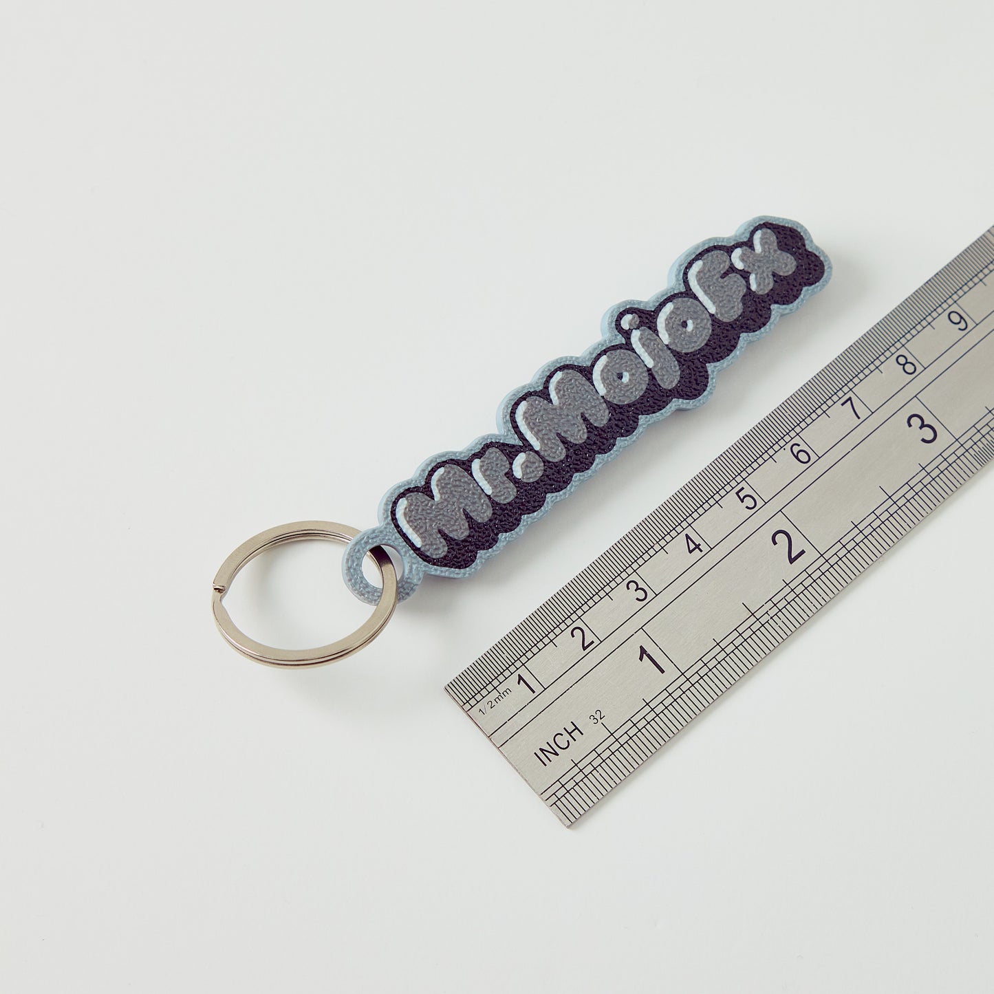 MrMojoFx Mono Key Fob next to ruler showing 80mm length, white background