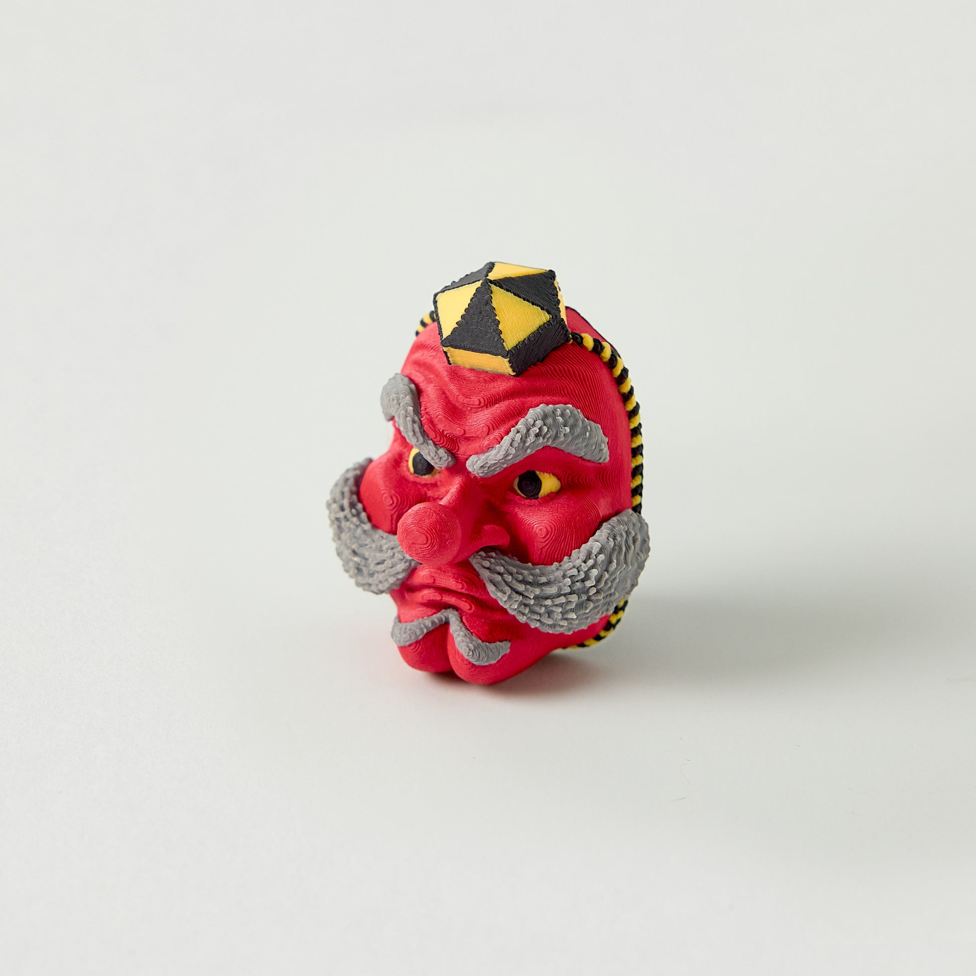 Tengu Topper — Japanese long-nose demon mask effects pedal switch topper front view for 10mm guitar and bass footswitch