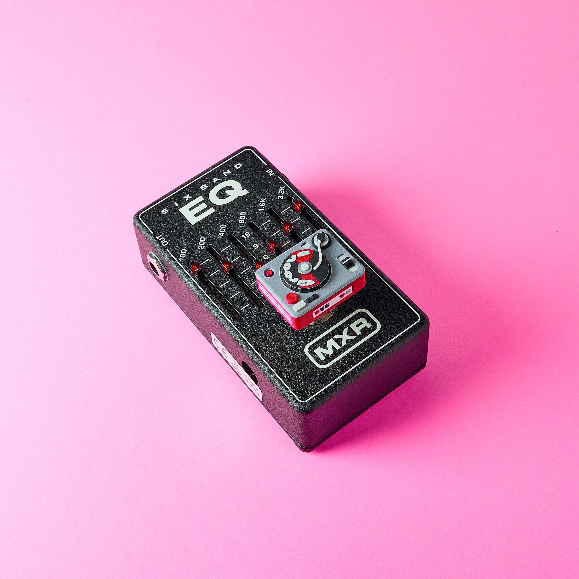 Turntable Topper mounted on MXR guitar effects EQ pedal footswitch using screw fit system for standard 10mm switches