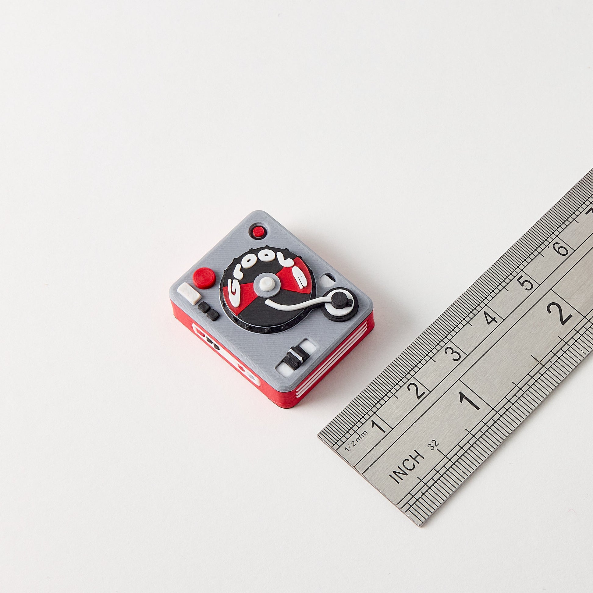Turntable Topper size reference with ruler showing small batch small batch hand finished vinyl record guitar effects pedal footswitch accessory
